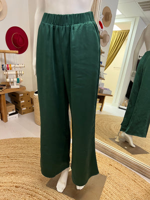 Green satin pants on a mannequin