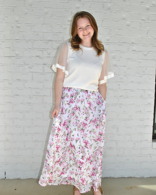 White top with pink floral skirt