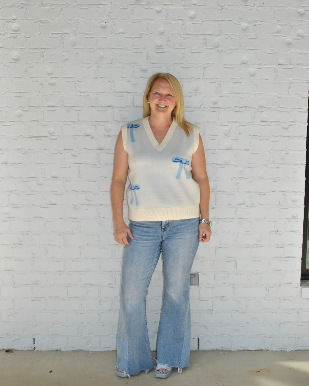 Bow sweater vest with jeans