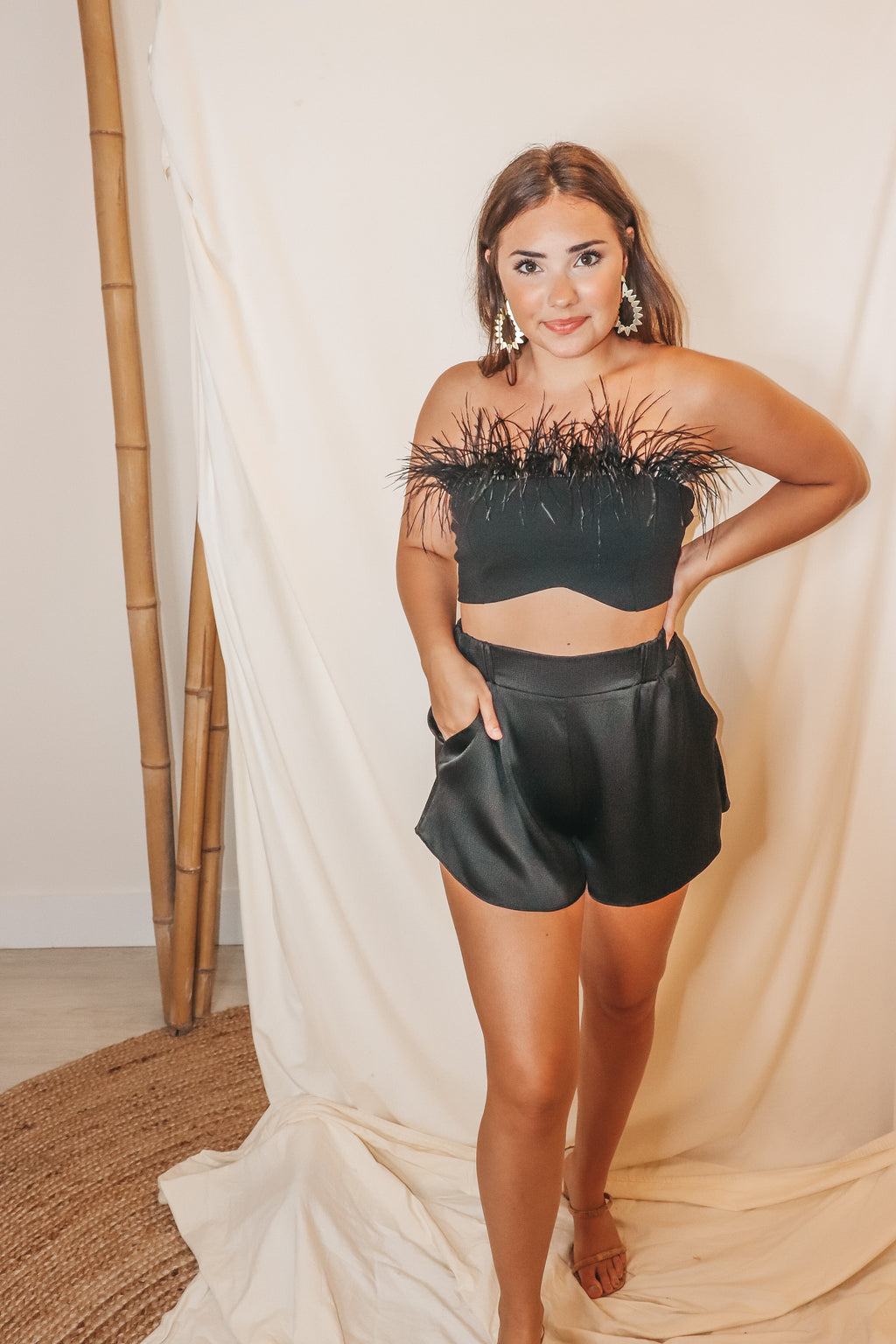 black tube top with feathers